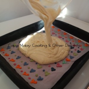 Pour the batter on top of the frozen design