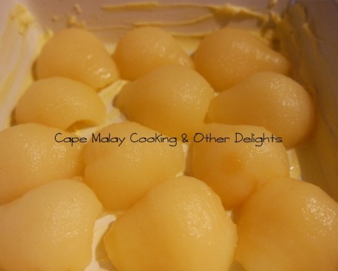 Arrange the pear halves in a greased oven proof dish